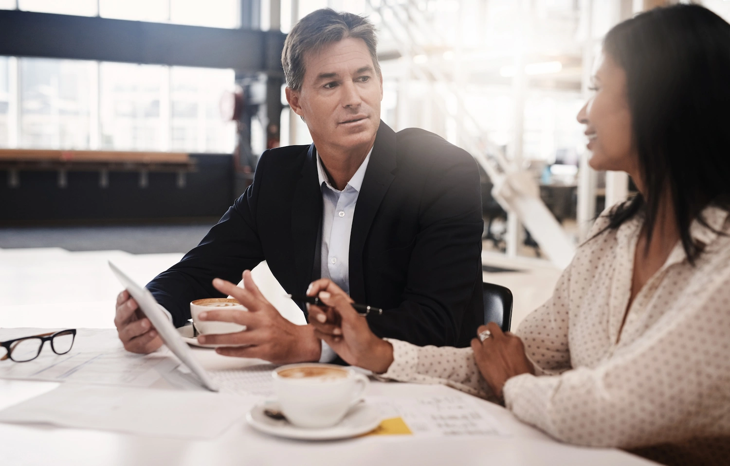 Financial advisor guiding high-net-worth client on tax strategies.