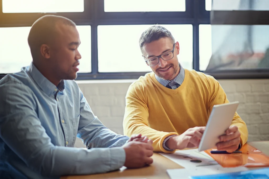 A financial advisor discussing potential charitable giving strategies with his client.