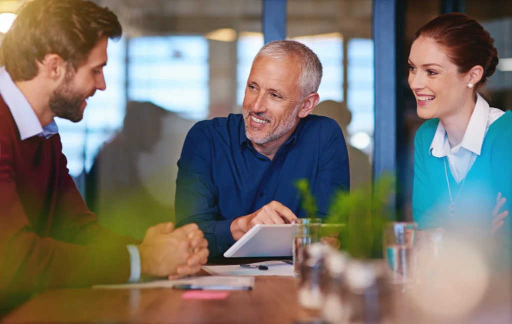 Employee discussing a rollover vs transfer with his financial advisor.