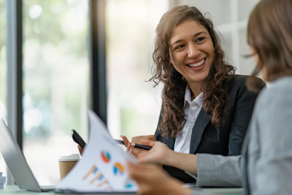 Smiling woman discussing annuities with her financial advisor.